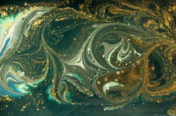 Green marble abstract acrylic background. Marbling artwork texture. Agate ripple pattern. Gold powder.