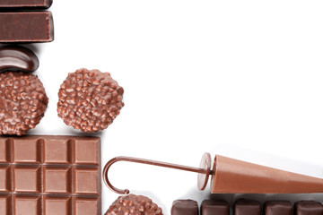 Delicious chocolate with candies on  white background