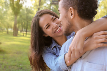 Naklejka premium Happy African-American couple in park on spring day