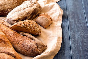 Fresh tasty bakery products on wooden table