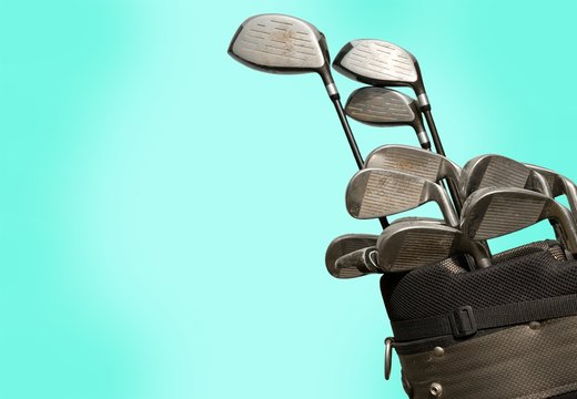 Different golf clubs on background