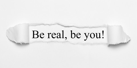 Be real, be you! on white torn paper