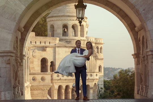 young happy romantic wedding couple outdoors in city
