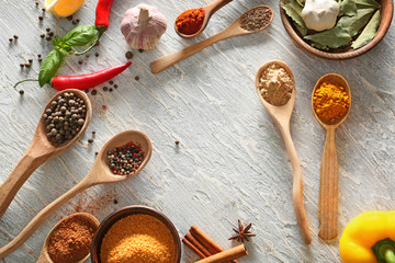 Frame made of different spices on light background