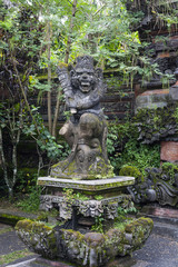 Fototapeta na wymiar Statue of old stone cruel monkey Hindu temple, Ubud, Bali