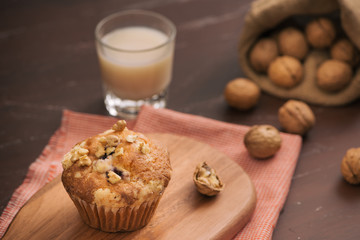Tasty homemade walnut muffins on table. Sweet pastries