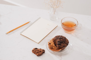 Breakfast with fresh homemade delicious muffins and tea.