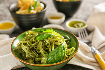 Delicious pasta with pesto sauce in bowl, closeup