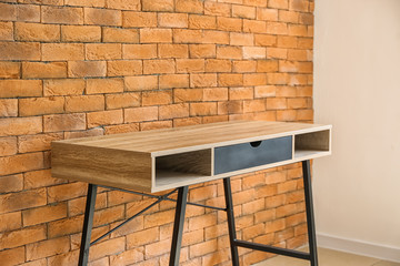 Table near brick wall