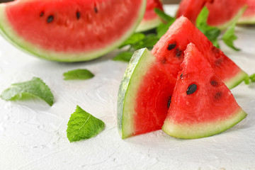 Sweet watermelon slices on white table