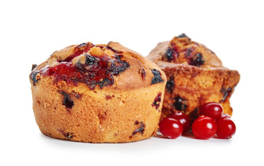 Sweet tasty muffins with cranberry on white background