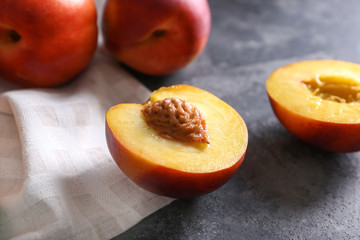 Fresh cut peach on dark table, closeup