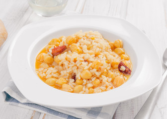 dish of homemade chickpeas on white wooden board
