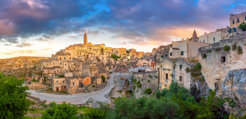Panorama of the ancient city of Matera at sunset. Southern Italy. Europe - obrazy, fototapety, plakaty