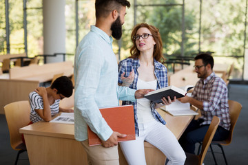 Group of students discussing in university