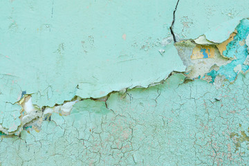Close-up detail of cracked paint on wall. 