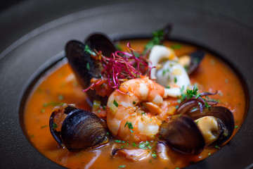 Delicious mediterranean seafood soup with mussels and prawns