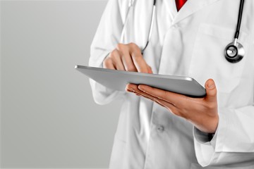 Close-up Doctor at hospital working with tablet