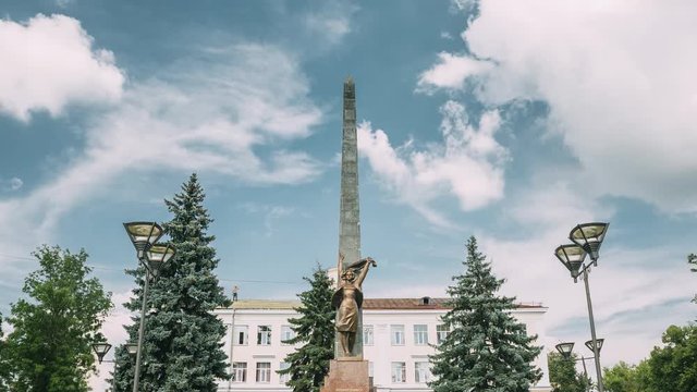 Gomel, Belarus. Monument To Heroes-members Of The Komsomol At Crossroads Of Streets Of Karpovicha And Zharkovskogo In Sunny Winter Day, Hyperlapse