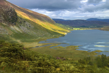 Naklejka na ściany i meble Scottish landscape. Loch Lee in Angus, Aberdeenshire, Scotland. Cairngorms, south of the Grampian Mountains. 