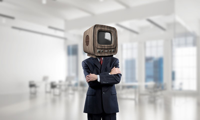 Businessman with old TV instead of head.