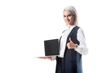 portrait of businesswoman holding laptop with blank screen and showing thumb up isolated on white