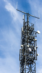 Antenna mast with many satellite shots, parabolants and directional antennas for listening,...