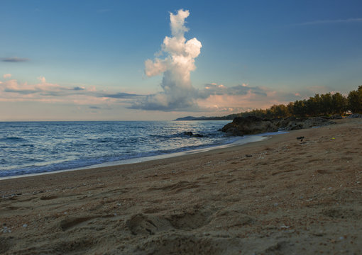 Beautiful beach in East Coast Malaysia with storm cloud blue sky background and blue ocean