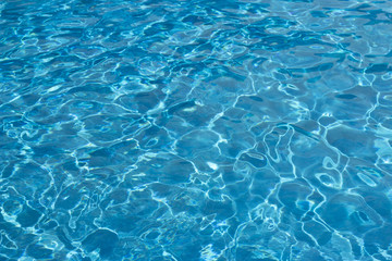 Blue sea water or water in the pool close-up, texture, background