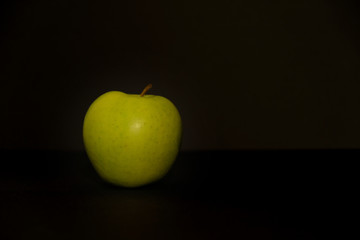 Apple on black background