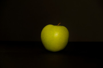 Apple on black background