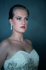 Glamourous retro 1950s woman in white dress.