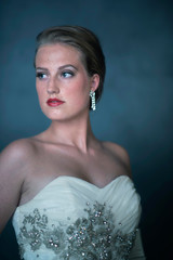 Glamourous retro 1950s woman in white dress.