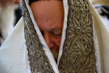 Religious Jews pray at the Western Wall in Jerusalem. Prayer of the Coens in honor of the Jewish holiday Pesach
