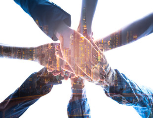 Double exposure ofTeamwork Concept,Group of diversity people to greeting power tag team,Teamwork Join Hands Partnership Concept of people putting their hands together,Friends with hands showing unity.