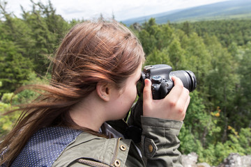 Woman taking pictures of nature