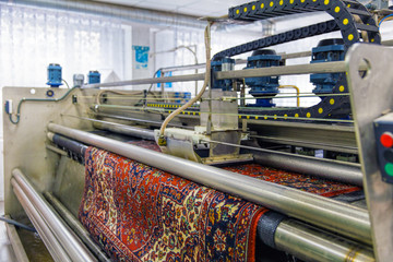 Automatic washing and cleaning of carpets. Industrial line for washing carpets