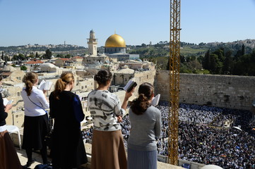 Religious Jews pray at the Western Wall in Jerusalem. Prayer of the Coens in honor of the Jewish holiday Pesach