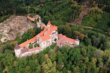 Obraz premium Gothic castle Pernstejn in Eastern region of the Czech Republic surrounded by forest