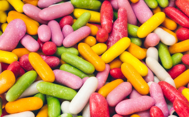 Fototapeta na wymiar Full frame closeup of multi-colored candy sticks / sweets