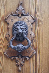 beautiful door handle on wooden door close-up