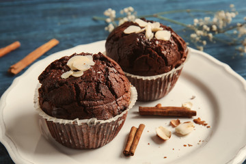 Tasty chocolate muffins on plate