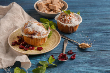 Tasty muffins on wooden table