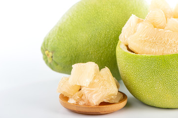 fresh and peeled pomelo(shaddock), grapefruit with slices isolated on white background