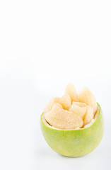 fresh and peeled pomelo(shaddock), grapefruit with slices isolated on white background