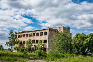 Fototapeta na wymiar Old, destroyed, abandoned houses and buildings, broken Windows and doors