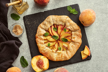 Delicious peach galette on slate plate