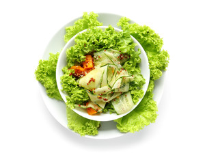 Plates with healthy fresh salad on white background