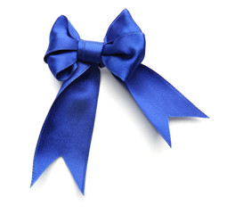 Beautiful bow made from blue ribbon on white background