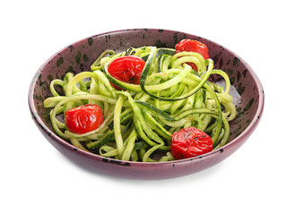 Bowl with zucchini spaghetti and tomatoes isolated on white